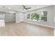 Light-filled living room with hardwood floors and view to entryway at 623 15Th Nw Ave, Largo, FL 33770