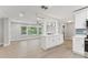 Open concept kitchen with white cabinets and island at 623 15Th Nw Ave, Largo, FL 33770