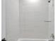 Clean bathroom with white tile and a shower/tub combo at 2608 W Columbus Dr # 3, Tampa, FL 33607