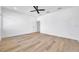 Bright bedroom with wood-look floors and ceiling fan at 2608 W Columbus Dr # 3, Tampa, FL 33607