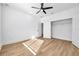 Well-lit bedroom with hardwood floors and a large closet at 2608 W Columbus Dr # 3, Tampa, FL 33607