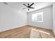 Light-filled bedroom featuring hardwood floors and a ceiling fan at 2608 W Columbus Dr # 3, Tampa, FL 33607