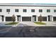 Modern townhomes with attached garages and landscaping at 2608 W Columbus Dr # 3, Tampa, FL 33607