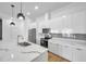 Modern kitchen with stainless steel appliances and white cabinets at 2608 W Columbus Dr # 3, Tampa, FL 33607