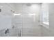 Large walk-in shower with marble tile and glass enclosure at 2608 W Columbus Dr # 3, Tampa, FL 33607