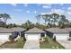 Aerial view of a new home community, showcasing houses with gray roofs and brick pavers at 9458 Shorebird Ct, Parrish, FL 34219