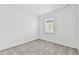 Simple bedroom with gray carpet and a window at 9458 Shorebird Ct, Parrish, FL 34219