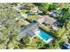 Aerial view of a property showcasing a backyard pool and expansive green space at 164 23Rd Sw Ave, Largo, FL 33778