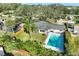 Aerial shot showcases a home with a pool, landscaped yard, and a serene outdoor living space at 164 23Rd Sw Ave, Largo, FL 33778