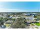 This aerial view shows a residential street, business offices, and the surrounding landscape at 164 23Rd Sw Ave, Largo, FL 33778