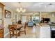 Bright dining area adjacent to a cozy living room and a modern kitchen that creates an inviting atmosphere at 164 23Rd Sw Ave, Largo, FL 33778