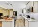 Bright kitchen with white cabinetry, granite countertops, and stainless steel appliances offering a modern aesthetic at 164 23Rd Sw Ave, Largo, FL 33778