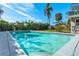 Inviting in-ground pool surrounded by lush greenery, offering a private and relaxing outdoor space at 164 23Rd Sw Ave, Largo, FL 33778