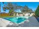 Enjoy outdoor living with a large pool and patio area, ideal for summer fun and relaxation at 164 23Rd Sw Ave, Largo, FL 33778