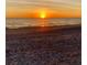 Stunning sunset view over a tranquil beach at 105 162Nd Ave, Redington Beach, FL 33708