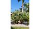 Lush landscaping with native plants and a house number sign at 105 162Nd Ave, Redington Beach, FL 33708