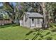 Large backyard with shed and mature trees at 3110 Camphor Dr, Plant City, FL 33566