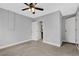 Main bedroom with ceiling fan and access to bathroom at 3110 Camphor Dr, Plant City, FL 33566