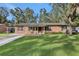 Ranch style home with a spacious lawn at 3110 Camphor Dr, Plant City, FL 33566