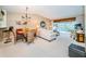 Bright dining area with table and chairs, adjacent to living room at 14880 Shipwatch Trce # 1915, Largo, FL 33774