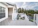 Private balcony overlooking lush landscaping and a parking area at 14880 Shipwatch Trce # 1915, Largo, FL 33774