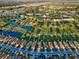 Aerial view of community with golf course and residential homes at 1923 Sterling Glen Ct, Sun City Center, FL 33573