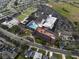 Aerial view of community center with pool, parking, and recreational areas at 1923 Sterling Glen Ct, Sun City Center, FL 33573