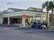 Community center atrium with golf carts parked outside at 1923 Sterling Glen Ct, Sun City Center, FL 33573