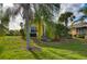 House exterior showcasing landscaping and a partial view of the home at 1923 Sterling Glen Ct, Sun City Center, FL 33573