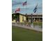 Lawn bowling green with flags and benches at 1923 Sterling Glen Ct, Sun City Center, FL 33573