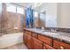 Bathroom with granite countertops, double sinks and shower/tub combo at 19230 Climbing Aster Dr, Tampa, FL 33647