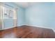 Light and airy bedroom with hardwood floors and light blue walls at 19230 Climbing Aster Dr, Tampa, FL 33647