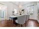 Elegant dining room with hardwood floors and a chandelier at 19230 Climbing Aster Dr, Tampa, FL 33647