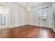 Bright dining room features hardwood floors and a chandelier at 19230 Climbing Aster Dr, Tampa, FL 33647