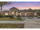 Stunning two-story house exterior at dusk at 19230 Climbing Aster Dr, Tampa, FL 33647