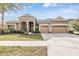 Two-story home with three-car garage at 19230 Climbing Aster Dr, Tampa, FL 33647