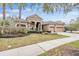 Two-story home with three-car garage at 19230 Climbing Aster Dr, Tampa, FL 33647