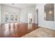 Spacious living room with hardwood floors and pool view at 19230 Climbing Aster Dr, Tampa, FL 33647