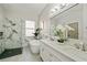 Elegant bathroom with a soaking tub and marble shower at 3405 Loggerhead Way, Wesley Chapel, FL 33544