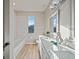 Bathroom with double vanity and subway tile shower at 3405 Loggerhead Way, Wesley Chapel, FL 33544