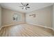 Bright bedroom with hardwood floors and access to patio at 3405 Loggerhead Way, Wesley Chapel, FL 33544