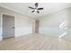 Bedroom with ceiling fan and wainscoting at 3405 Loggerhead Way, Wesley Chapel, FL 33544