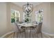 Bright breakfast nook with built-in seating and a view to the pool at 3405 Loggerhead Way, Wesley Chapel, FL 33544