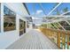 Relaxing deck with a screened enclosure overlooking the pool area at 3405 Loggerhead Way, Wesley Chapel, FL 33544