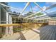 Spacious deck with a screened enclosure, ideal for outdoor living at 3405 Loggerhead Way, Wesley Chapel, FL 33544