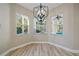 Bright dining area with hardwood floors and a chandelier at 3405 Loggerhead Way, Wesley Chapel, FL 33544