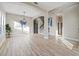 Elegant dining room features hardwood floors and chandelier at 3405 Loggerhead Way, Wesley Chapel, FL 33544