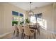 Formal dining room with hardwood floors and modern chandelier at 3405 Loggerhead Way, Wesley Chapel, FL 33544