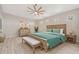 Spacious main bedroom with light wood flooring and a ceiling fan at 3405 Loggerhead Way, Wesley Chapel, FL 33544