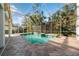 Inviting screened pool and spa with plenty of space for relaxation at 3405 Loggerhead Way, Wesley Chapel, FL 33544